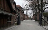 People visit the Memorial and Museum Auschwitz-Birkenau, a former Nazi German concentration and extermination camp, in Oswiecim, Poland, Sunday, Jan. 26, 2025. (AP Photo/Czarek Sokolowski)