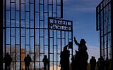 People visit the Nazi Concentration Camp Sachsenhausen on International Holocaust Remembrance Day, in Oranienburg, Germany, January 27, 2025. (AP Photo/Markus Schreiber)