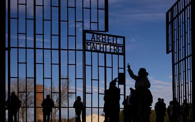 People visit the Nazi Concentration Camp Sachsenhausen on International Holocaust Remembrance Day, in Oranienburg, Germany, January 27, 2025. (AP Photo/Markus Schreiber)