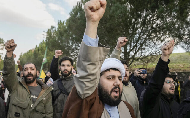 Locals shout slogans against Israel soldiers blocking a road leading to their southern Lebanese village of Maroun el-Rass, Lebanon, Monday, Jan. 27, 2025. (AP Photo/Bilal Hussein)