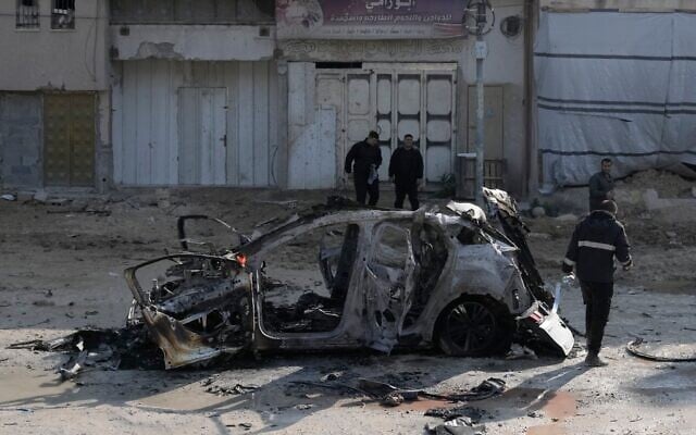 Illustrative: People view wreckage of a vehicle destroyed in an Israeli strike in the refugee camp of Nur Shams, near Tulkarem in the northern Wet Bank, January 27, 2025. (AP Photo/Majdi Mohammed) Illustrative: People view wreckage of a vehicle destroyed in an Israeli strike in the refugee camp of Nur Shams, near Tulkarem in the northern Wet Bank, January 27, 2025. (AP Photo/Majdi Mohammed)