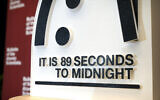 The Doomsday Clock of the Bulletin of the Atomic Scientists, set at 89 seconds to midnight, is displayed during a news conference at the United States Institute of Peace, January 28, 2025, in Washington. (AP Photo/Mark Schiefelbein)