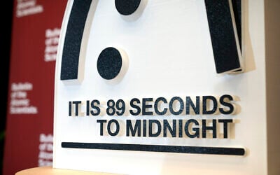The Doomsday Clock of the Bulletin of the Atomic Scientists, set at 89 seconds to midnight, is displayed during a news conference at the United States Institute of Peace, January 28, 2025, in Washington. (AP Photo/Mark Schiefelbein)