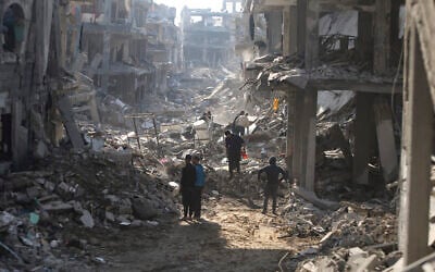 Palestinians who have returned inspect their houses, which were destroyed during the war between Israel and Hamas, in Jebaliya, northern Gaza Strip, January 29, 2025. (Jehad Alshrafi/AP)