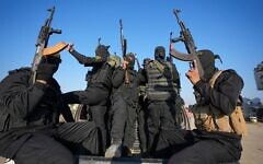 Fighters from the Hamas and Islamic Jihad terror groups before the handover of hostages to the Red Cross in the south Gaza Strip town of Khan Younis, Jan. 30, 2025.(AP Photo/Abdel Kareem Hana)