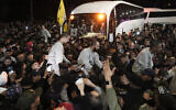 Crowd greets Palestinian prisoners after being released from Israeli prison following a ceasefire agreement between Israel and Hamas, in the West Bank city of Ramallah, Thursday, Jan. 30, 2025. (AP/Mahmoud Illean)