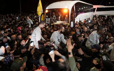 Crowd greets Palestinian prisoners after being released from Israeli prison following a ceasefire agreement between Israel and Hamas, in the West Bank city of Ramallah, Thursday, Jan. 30, 2025. (AP/Mahmoud Illean)