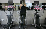 Illustrative: A woman works out at a gym in Jerusalem (Olivier Fitoussi/ Flash90)