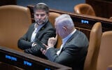 Finance Minister Bezalel Smotrich (left) and Prime Minister Benjamin Netanyahu attend a vote in the Knesset plenum,  Jerusalem, December 31, 2024. (Chaim Goldberg/Flash90)
