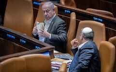 Prime Minister Benjamin Netanyahu (left) with National Security Minister Itamar Ben Gvir (right) in the Knesset on December 31, 2024 (Chaim Goldberg / Flash 90)
