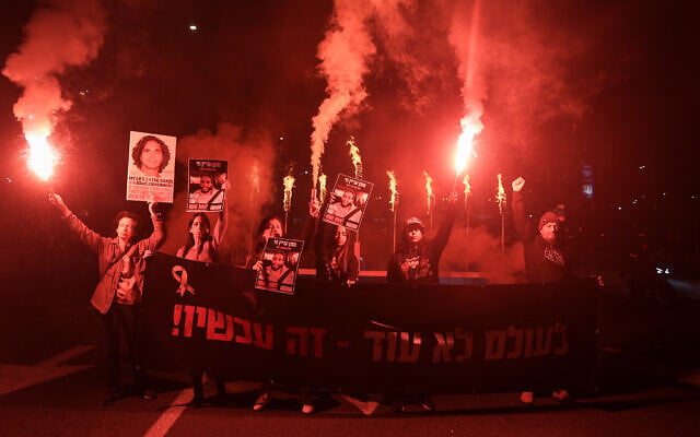 Families of Israelis held hostage by Hamas terrorists in Gaza block the Ayalon Highway in Tel Aviv as they call for the release of the hostages, on the eighth night of the Jewish holiday of Hanukkah, January 01, 2025. (Itai Ron/Flash90) Families of Israelis held hostage by Hamas terrorists in Gaza block the Ayalon Highway in Tel Aviv as they call for the release of the hostages, on the eighth night of the Jewish holiday of Hanukkah, January 01, 2025. (Itai Ron/Flash90)