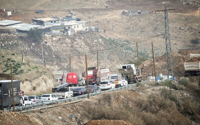 Palestinians wait at an Israeli checkpoint between the West Bank cities of Nablus and Jenin, January 11, 2025. (Nasser Ishtayeh/Flash90)