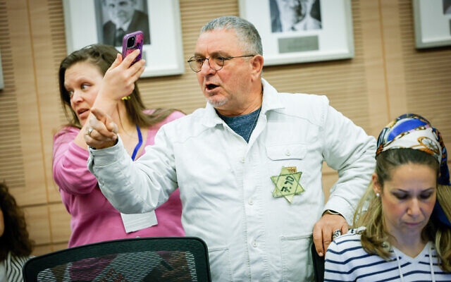 Families of Israelis held hostage by Hamas terrorists in Gaza attend a discussion at the Foreign Affairs and Defense Committee meeting at the Knesset in Jerusalem, on January 14, 2025. (Yonatan Sindel/Flash90)