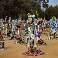 Photos of Israelis murdered at the Nova music festival on October 7, 2023, are posted at the site of the massacre, in southern Israel's Re'im, January 16, 2025. (Chaim Goldberg/Flash90)