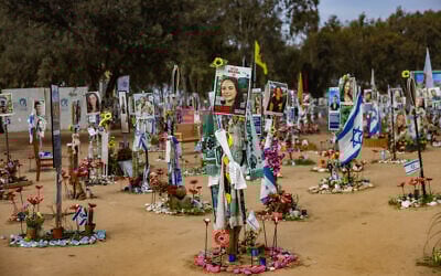 Photos of Israelis murdered at the Nova music festival on October 7, 2023, are posted at the site of the massacre, in southern Israel's Re'im, January 16, 2025. (Chaim Goldberg/Flash90)
