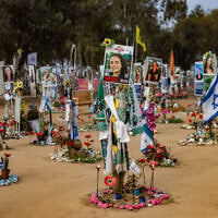 Photos of Israelis murdered at the Nova music festival on October 7, 2023, are posted at the site of the massacre, in southern Israel's Re'im, January 16, 2025. (Chaim Goldberg/Flash90)
