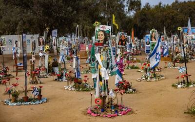 Photos of Israelis murdered at the Nova music festival on October 7, 2023, are posted at the site of the massacre, in southern Israel's Re'im, January 16, 2025. (Chaim Goldberg/Flash90)