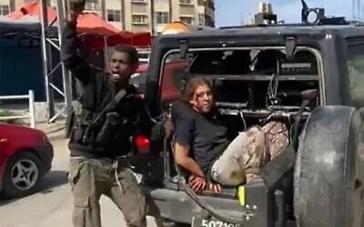 Screen capture from video of Hamas terrorist Muhammad Abu Aseed celebrates as he abducts IDF soldier Naama Levy on October 7, 2023. (Used in accordance with Clause 27a of the Copyright Law)
