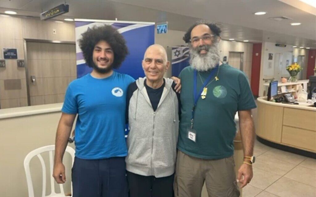 Safely home, freed hostage Gadi Mozes shaves son’s 482-day beard