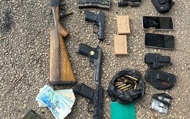 Weapons captured from a wanted Palestinian who was killed by Border Police officers in the West Bank town of Meithalun, January 5, 2024. (Israel Police)