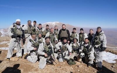 Defense Minister Israel Katz meets with troops of the Alpinist Unit atop the summit of Mount Hermon, Syria, on January 28, 2025. (Ariel Hermoni/Defense Ministry)