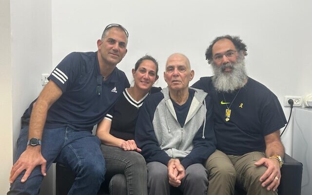 Freed hostage Gadi Mozes, second right, with his children Iddo, Moran and Yair at Ichilov hospital on January 30, 2025. (Courtesy)