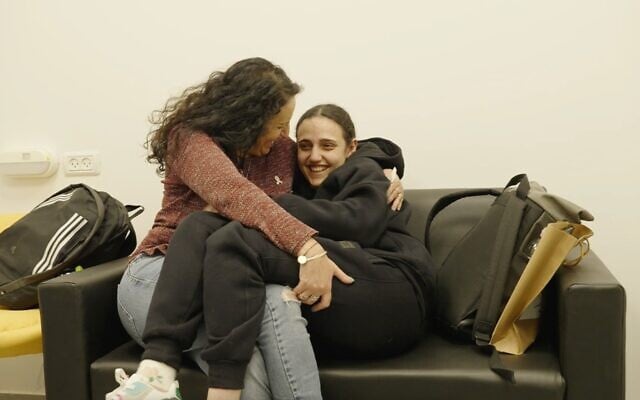 Romi Gonen (right) and her mother, Meirav Leshem Gonen, embrace after Romi's return from Hamas captivity, January 19, 2025. (IDF)