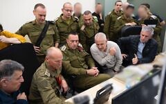 IDF Chief of Staff Lt. Gen. Herzi Halevi (center) is seen at a command center for the release of hostages held by Hamas, on January 25, 2025, alongside Mossad chief David Barnea (left), Shin Bet head Ronen Bar (2nd from left), hostage pointman Maj. Gen (res.) Nitzan Alon (2nd from right), and Maj. Gen. (res.) Yoav Mordechai (right). Also in the room are IDF Intelligence Directorate chief Maj. Gen. Shlomi Binder and Prime Minister Benjamin Netanyahu's military secretary Maj. Gen. Roman Gofman. (Israel Defense Forces)