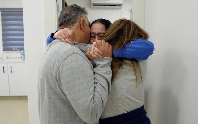 Released hostage Liri Albag is seen with her parents after being freed from Hamas captivity on January 25, 2025 (Israel Defense Forces)