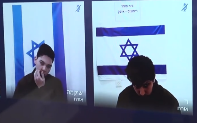 Two IDF reservists arrested on suspicion of spying for Iran, Yuri Eliasfov (L) and Georgi Andreyev (R), appear on video at a court hearing to extend their detention on January 27, 2025. (Screenshot from Ynet)