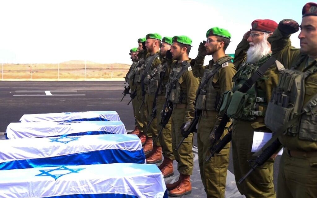 The IDF holds a ceremony in the Gaza Strip honoring the four slain Israeli hostages whose bodies are apparently in coffins returned by Hamas, February 20, 2025. The coffins are seen draped in Israeli flags. (IDF)
