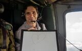 Freed hostage Ofer Calderon in an IDF helicopter en route to Sheba Medical Center after his release from Hamas captivity in Gaza, February 1, 2025. (IDF)