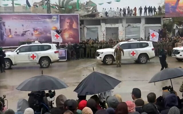 Red Cross vehicles arrive at the site of the expected handover of Israeli hostages in Rafah, in the southern Gaza Strip on February 22, 2025 (Screen grab/YouTube)