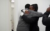 Relatives are reunited with Avera Mengistu at a military facility near Re'im on February 22, 2025. (IDF)