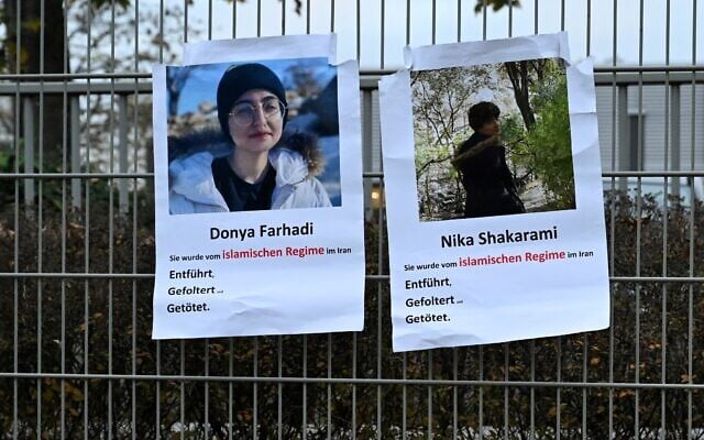 Placards with photos of Iranian Nika Shakarami (R) and Donya Farhadi, both believed to be victims of the Iranian security forces, are seen on a fence during a rally against executions in Iran outside the Consulate General of the Islamic Republic of Iran in Frankfurt am Main, western Germany, on October 31, 2024 (Kirill KUDRYAVTSEV / AFP) Placards with photos of Iranian Nika Shakarami (R) and Donya Farhadi, both believed to be victims of the Iranian security forces, are seen on a fence during a rally against executions in Iran outside the Consulate General of the Islamic Republic of Iran in Frankfurt am Main, western Germany, on October 31, 2024 (Kirill KUDRYAVTSEV / AFP)