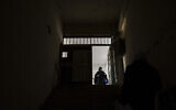 Illustrative: A Syrian man inspects the rooms the prison of Saydnaya, north of Damascus on December 16, 2024. (Sameer Al-DOUMY / AFP)