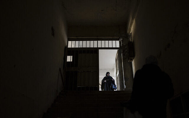 Illustrative: A Syrian man inspects the rooms the prison of Saydnaya, north of Damascus on December 16, 2024. (Sameer Al-DOUMY / AFP) Illustrative: A Syrian man inspects the rooms the prison of Saydnaya, north of Damascus on December 16, 2024. (Sameer Al-DOUMY / AFP)