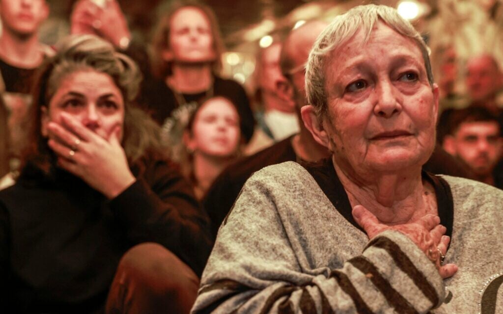 Michal Cohen, the mother of Ohad Ben Ami, watches a broadcast of his release in Tel Aviv on February 8, 2025 (Menahem Kahana / AFP)