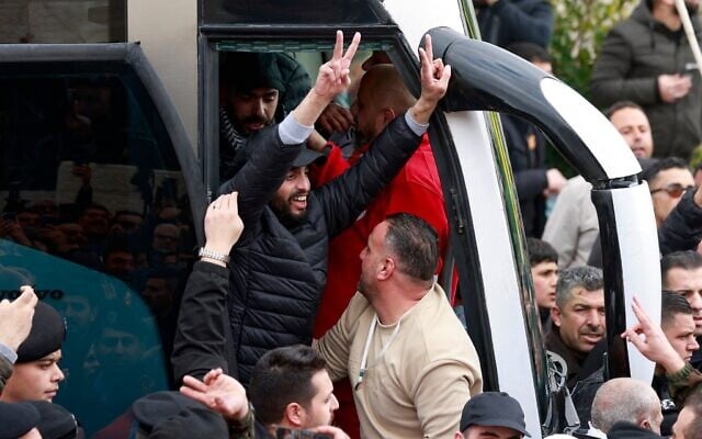 A Palestinian prisoner released by Israel as part of the hostage deal with Hamas flashes the victory sign as he alights a bus in the West Bank city of Ramallah on February 8, 2025. (Jaafar Ashtiyeh / AFP) A Palestinian prisoner released by Israel as part of the hostage deal with Hamas flashes the victory sign as he alights a bus in the West Bank city of Ramallah on February 8, 2025. (Jaafar Ashtiyeh / AFP)