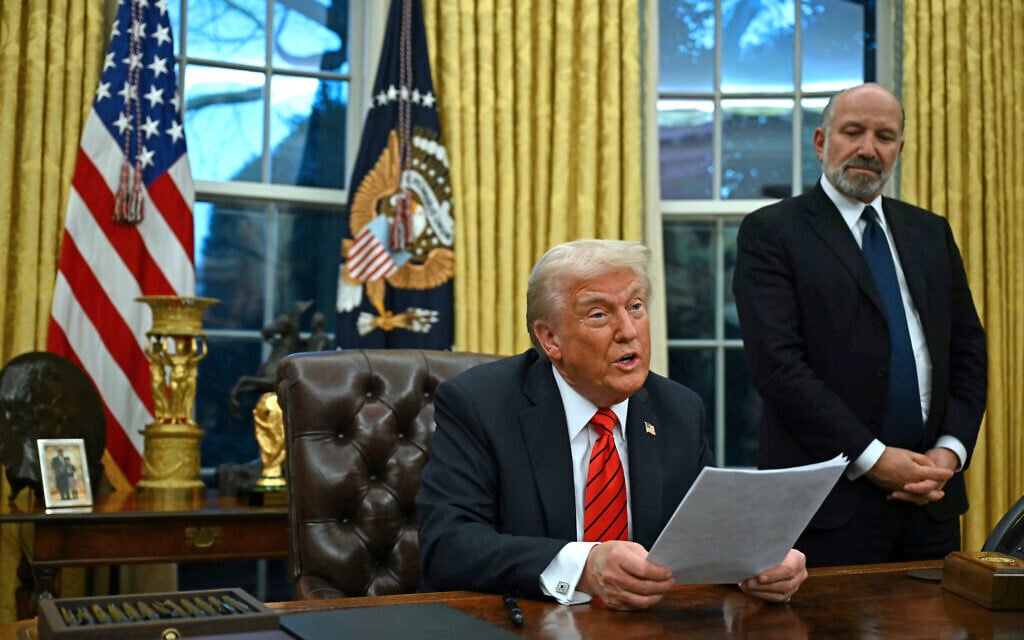 US President Donald Trump speaks to the press after signing an executive order, alongside US Secretary of Commerce nominee Howard Lutnick, in the Oval Office of the White House in Washington, DC, on February 10, 2025. (ANDREW CABALLERO-REYNOLDS / AFP)