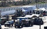 IDF troops assemble at the Ofer military prison complex, between Ramallah and Beitunia in the West Bank, before releasing Palestinian prisoners as part of a hostage-prisoner exchange on February 15, 2025. (Zain Jaafar / AFP)