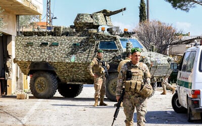Illustrative: Lebanese army soldiers stand guard at the entrance of the southern Lebanese village of Houla on February 17, 2025. (Photo by Mahmoud ZAYYAT / AFP)
