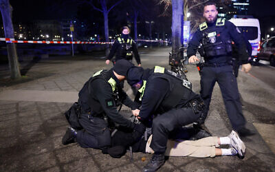 Police apprehend a suspect at the scene where a person was stabbed near the Holocaust Memorial in Berlin, Germany on February 21, 2025. (Odd Andersen/AFP) Police apprehend a suspect at the scene where a person was stabbed near the Holocaust Memorial in Berlin, Germany on February 21, 2025. (Odd Andersen/AFP)