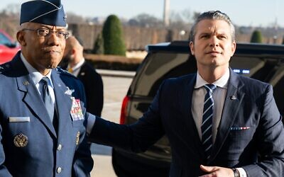 US Defense Secretary Pete Hegseth, alongside Chairman of the Joint Chiefs of Staff General Charles Q. Brown, Jr. (L), speaks with the media during his first official arrival at the Pentagon as secretary, in Washington on January 27, 2025. (Saul Loeb/AFP)