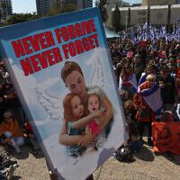 Mourners gather to pay their respects next to a makeshift memorial for Shiri, Ariel and Kfir Bibas at Hostages Square in Tel Aviv on February 26, 2025. (Ahmad Gharabli / AFP)