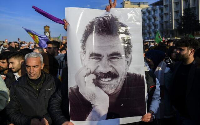 Supporters display a poster depicting jailed leader of the Kurdistan Workers' Party (PKK) Abdullah Ocalan, 75, after he called on the Kurdistan Workers' Party (PKK) to disarm and dissolve itself in Diyarbakir, southeastern Turkey, on February 27, 2025. (Yasin Akgul / AFP)