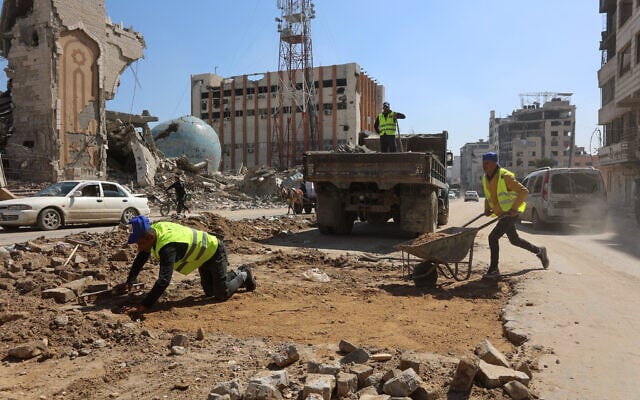 Workers fix a road in Gaza City in the central Gaza Strip on February 28, 2025, as the municipality prepares the city for the Muslim holy month of Ramadan, amid an ongoing truce in the war between Israel and Hamas (Omar AL-QATTAA / AFP) Workers fix a road in Gaza City in the central Gaza Strip on February 28, 2025, as the municipality prepares the city for the Muslim holy month of Ramadan, amid an ongoing truce in the war between Israel and Hamas (Omar AL-QATTAA / AFP)