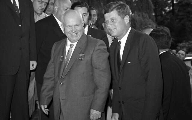 Then-Soviet premier Nikita Khrushchev, left, walks with US president John F. Kennedy at the residence of the US ambassador in Vienna, Austria on June 3, 1961. (AP Photo, File)