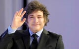 Argentina's President Javier Milei waves as he arrives for his speech at the Annual Meeting of World Economic Forum in Davos, Switzerland, January 23, 2025. (AP Photo/ Markus Schreiber)
