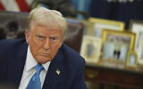 President Donald Trump speaks to reporters as he signs executive orders in the Oval Office of the White House, January 31, 2025, in Washington. (AP Photo/Evan Vucci)
